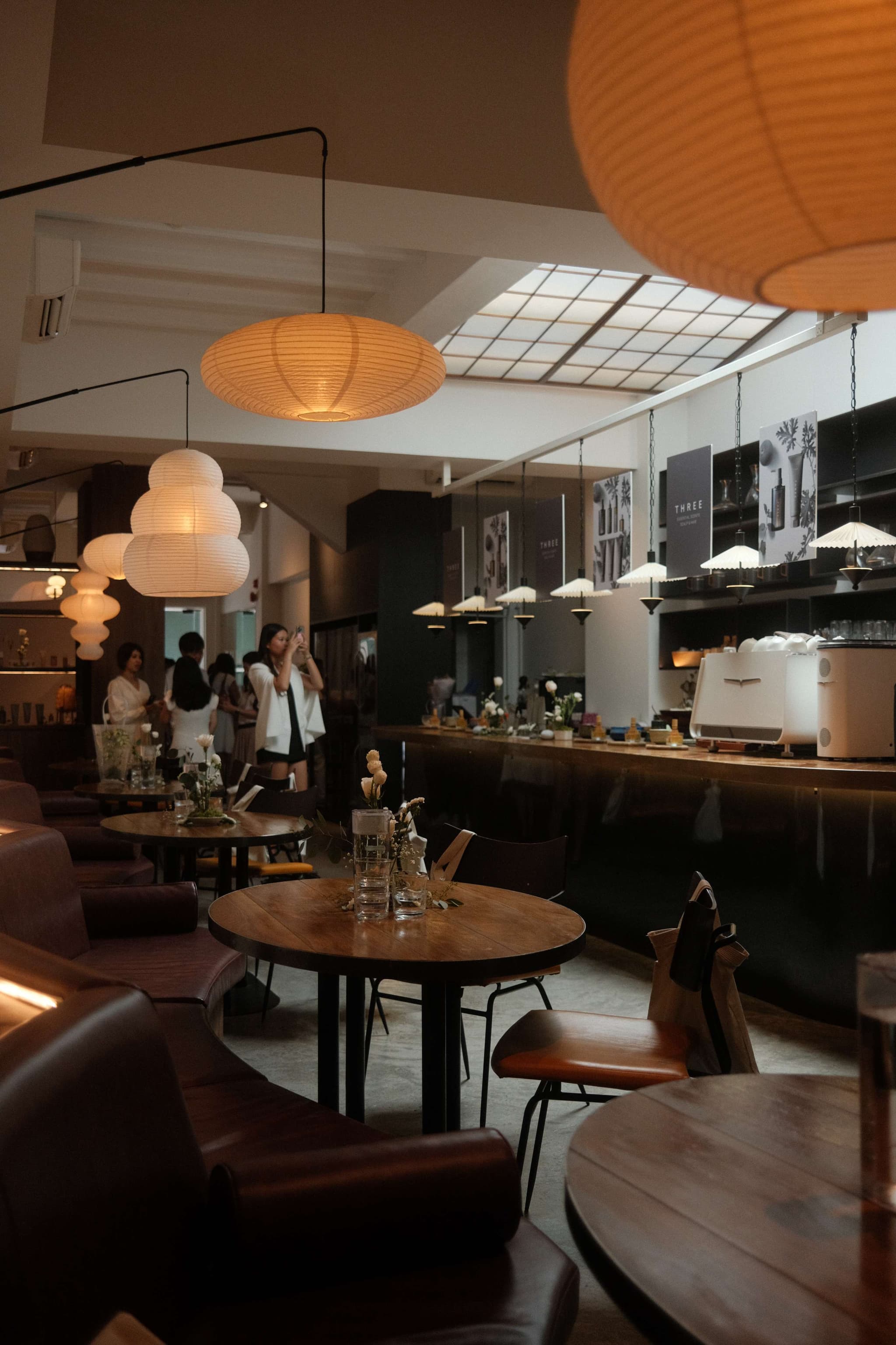 Cafe Gyoen interior with espresso bar and hanging lamps